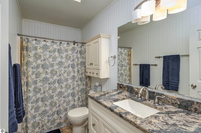 4215 Hearthside Dr, Traverse City, MI 49684 - bathroom featuring toilet, ornamental molding, vanity, and a shower with shower curtain