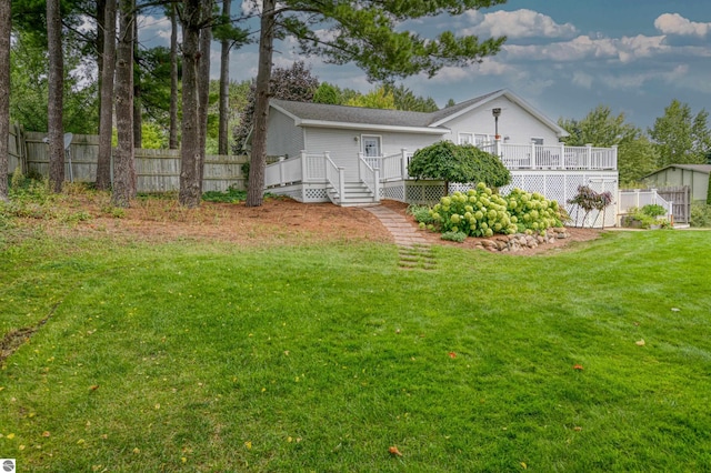 4215 Hearthside Dr, Traverse City, MI 49684 - view of yard with a wooden deck and fence