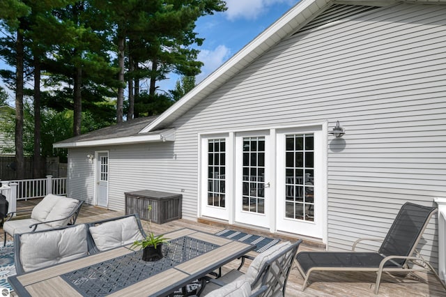 4215 Hearthside Dr, Traverse City, MI 49684 - wooden terrace featuring fence and outdoor dining area