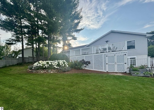 4215 Hearthside Dr, Traverse City, MI 49684 - view of yard featuring fence and a wooden deck