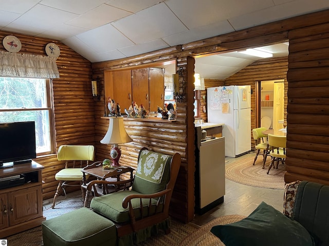 interior space with rustic walls and lofted ceiling