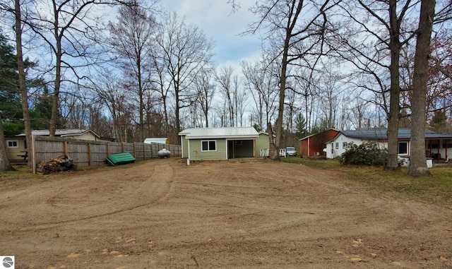 exterior space featuring fence and driveway
