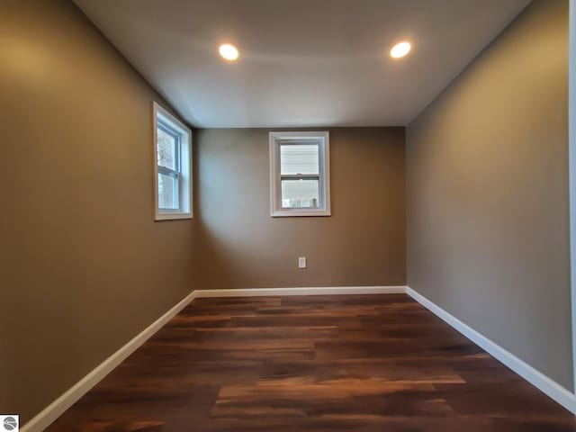 unfurnished room featuring baseboards, recessed lighting, and dark wood-style floors