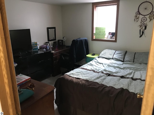 bedroom featuring tile patterned floors