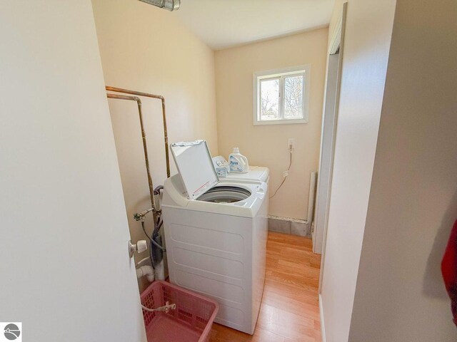9166 Michigan Ave, Saint Helen, MI 48656 - laundry area with laundry area, light wood-type flooring, and washing machine and dryer