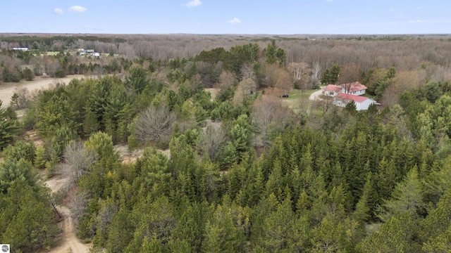 drone / aerial view with a view of trees