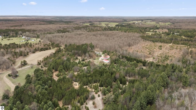 drone / aerial view featuring a forest view