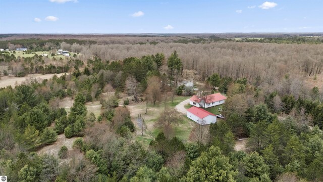 aerial view featuring a wooded view