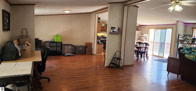 office featuring crown molding, a textured ceiling, ceiling fan, and wood finished floors