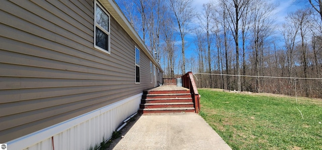 view of property exterior featuring a lawn