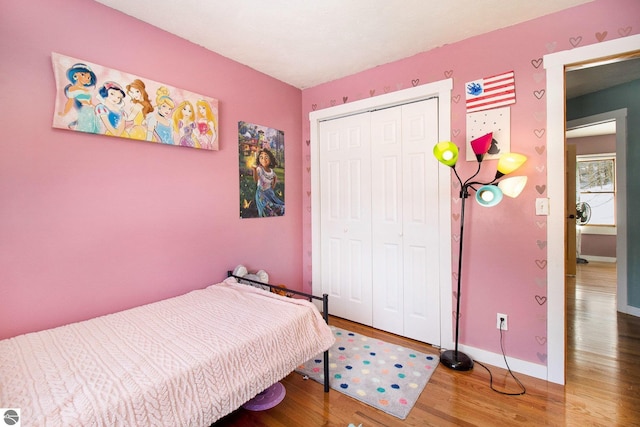 7809 Potter Rd, Bear Lake, MI 49614 - bedroom featuring a closet, baseboards, and wood finished floors
