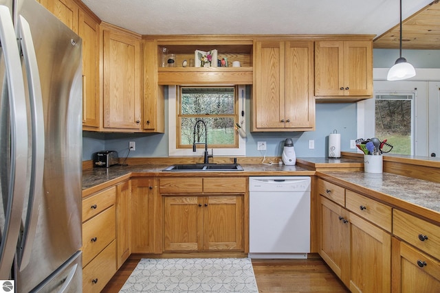 7809 Potter Rd, Bear Lake, MI 49614 - kitchen featuring a sink, wood finished floors, freestanding refrigerator, open shelves, and dishwasher