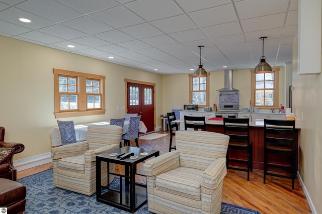 4130 W Dodge Springs Trl, Maple City, MI 49664 - living area with light wood finished floors, a drop ceiling, baseboards, and recessed lighting