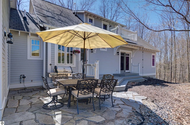 4130 W Dodge Springs Trl, Maple City, MI 49664 - view of patio with outdoor dining area, grilling area, and a balcony