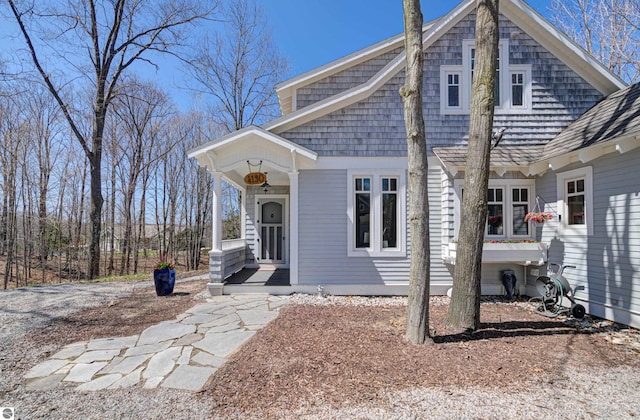 4130 W Dodge Springs Trl, Maple City, MI 49664 - view of front of property featuring a porch