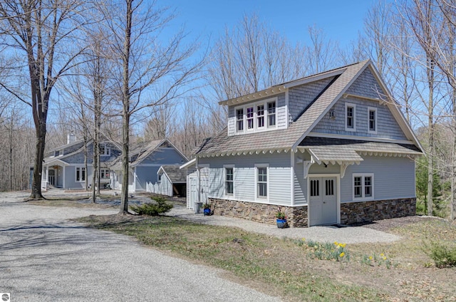 4130 W Dodge Springs Trl, Maple City, MI 49664 - view of front of home with stone siding
