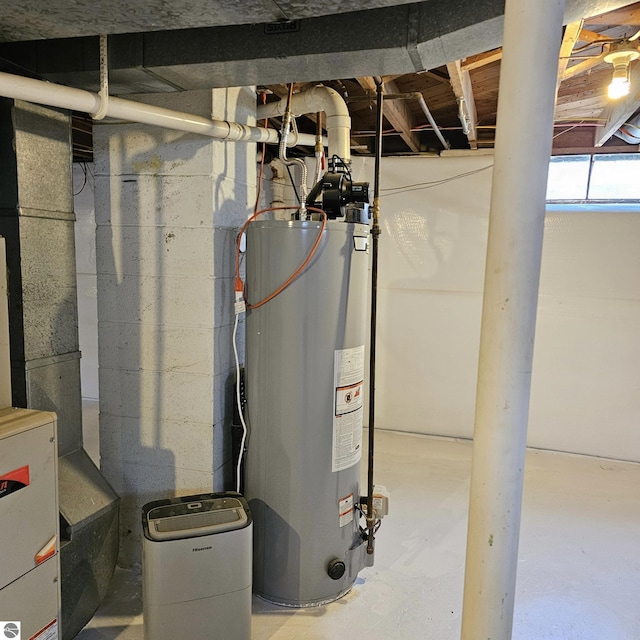 utility room featuring water heater