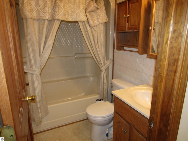 full bathroom with tile walls, toilet, shower / tub combo with curtain, vanity, and backsplash