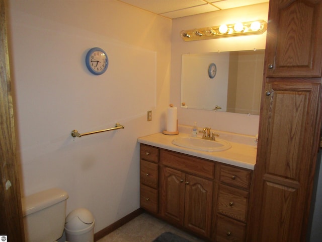 bathroom with toilet and vanity