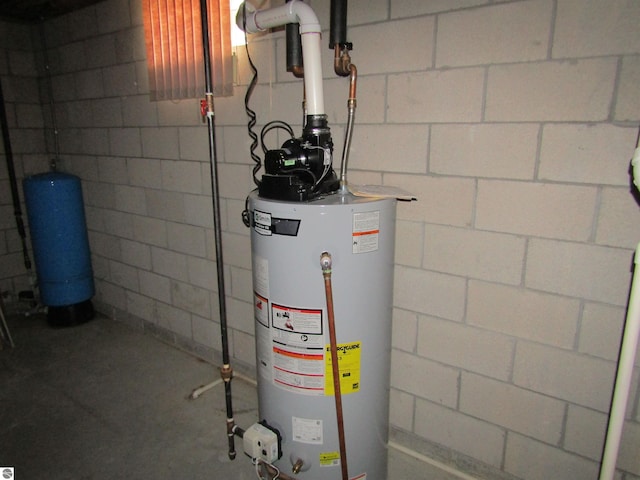 utility room featuring gas water heater
