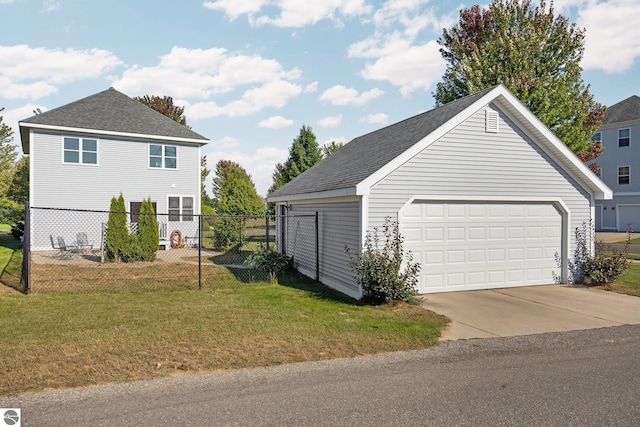 detached garage featuring fence