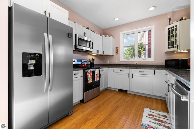 kitchen with light wood-style flooring, white cabinetry, recessed lighting, and appliances with stainless steel finishes