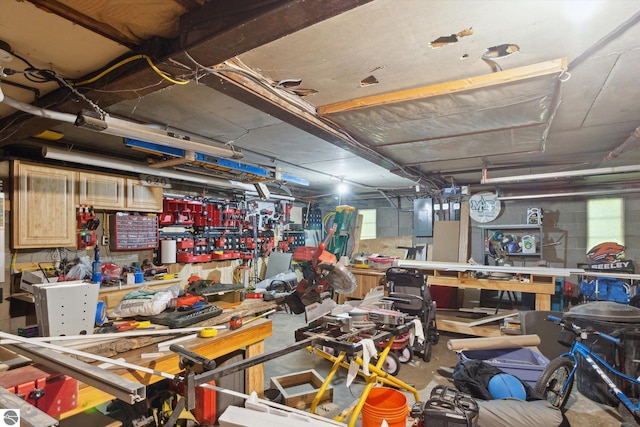 misc room featuring a workshop area and concrete flooring