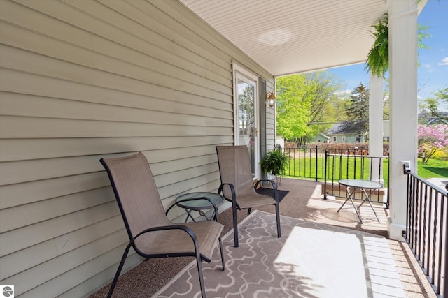 view of patio featuring a porch