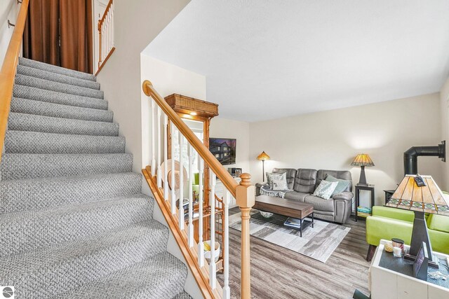 715 Lake Ave Unit 17-C, Traverse City, MI 49684 - stairs with wood finished floors