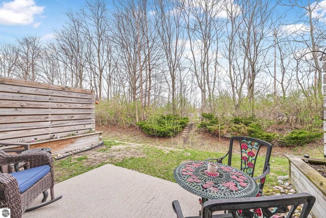 715 Lake Ave Unit 17-C, Traverse City, MI 49684 - view of yard featuring a patio area