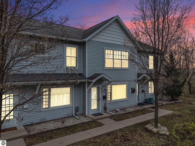 715 Lake Ave Unit 17-C, Traverse City, MI 49684 - traditional-style house featuring a shingled roof
