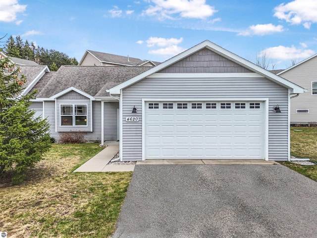 4620 Black Bear Dr Unit 49, Traverse City, MI 49685 - ranch-style house with a shingled roof, a front lawn, and driveway