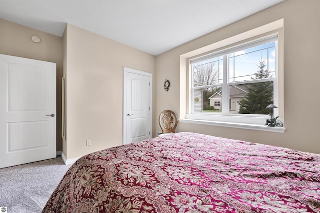 4620 Black Bear Dr Unit 49, Traverse City, MI 49685 - carpeted bedroom with baseboards