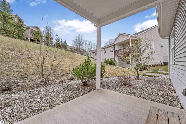 4620 Black Bear Dr Unit 49, Traverse City, MI 49685 - view of patio / terrace with a residential view