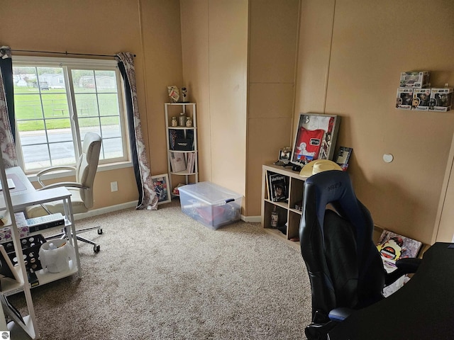 carpeted office space with baseboards