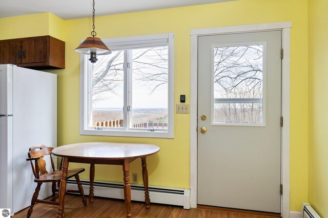 8822 Bahle Rd, Suttons Bay, MI 49682 - entryway featuring a wealth of natural light and baseboard heating