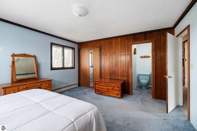 8822 Bahle Rd, Suttons Bay, MI 49682 - bedroom featuring crown molding, wooden walls, a baseboard heating unit, and carpet floors