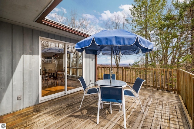 8822 Bahle Rd, Suttons Bay, MI 49682 - deck featuring outdoor dining space
