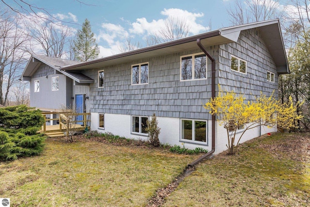 8822 Bahle Rd, Suttons Bay, MI 49682 - view of front of house with a deck and a front yard