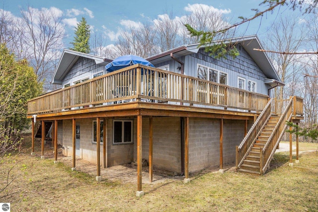 8822 Bahle Rd, Suttons Bay, MI 49682 - back of property with stairway and a wooden deck
