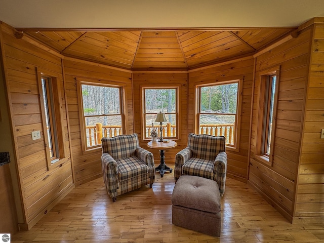 9184 S M-37, Wellston, MI 49689 - living area featuring wood ceiling, wood walls, lofted ceiling, and light wood-style floors