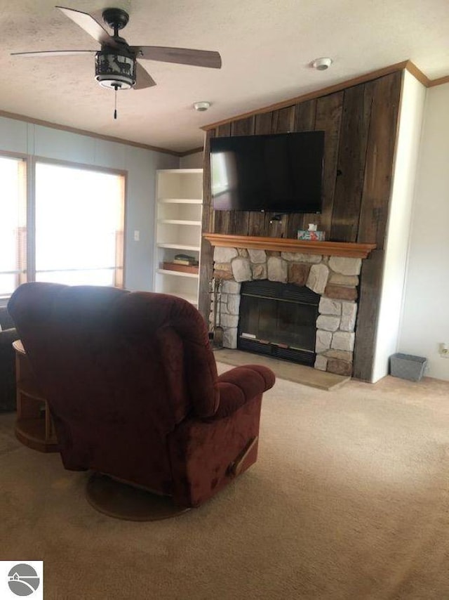 6626 Terry Ln, Hale, MI 48739 - living room with healthy amount of natural light, ceiling fan, ornamental molding, carpet flooring, and a fireplace