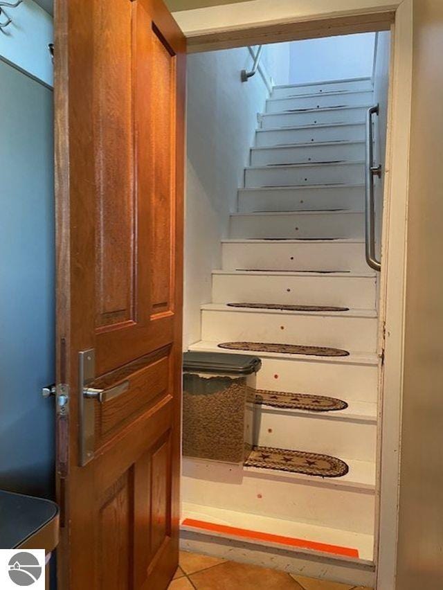 3312 Zimmerman Rd, Traverse City, MI 49685 - stairway with tile patterned floors