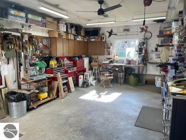 3312 Zimmerman Rd, Traverse City, MI 49685 - garage with a workshop area and ceiling fan