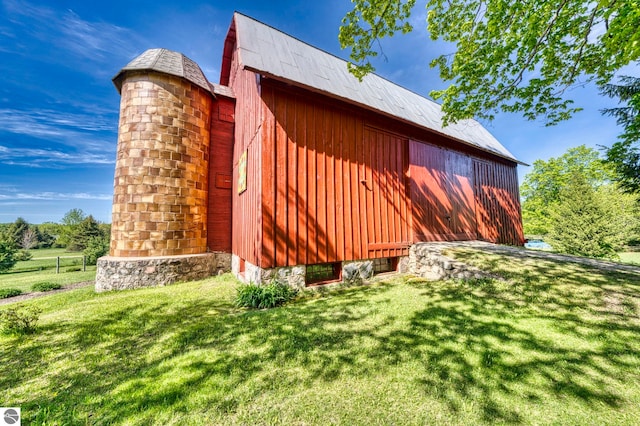 3312 Zimmerman Rd, Traverse City, MI 49685 - view of side of property with a lawn and an outbuilding