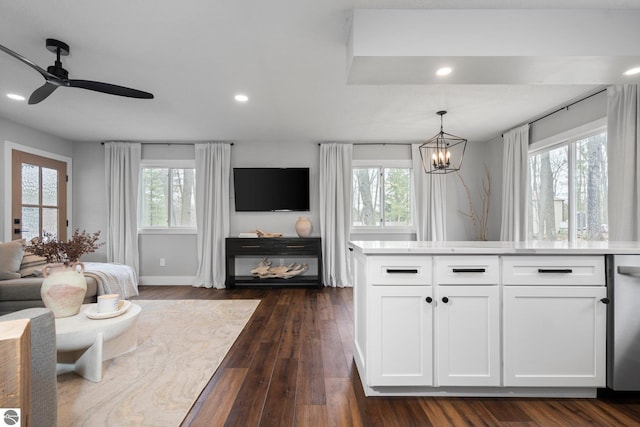 7555 Anthony St, Fife Lake, MI 49633 - living area featuring a chandelier, recessed lighting, a ceiling fan, dark wood-style floors, and baseboards