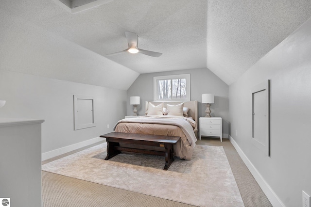 7555 Anthony St, Fife Lake, MI 49633 - carpeted bedroom featuring lofted ceiling, baseboards, and a ceiling fan