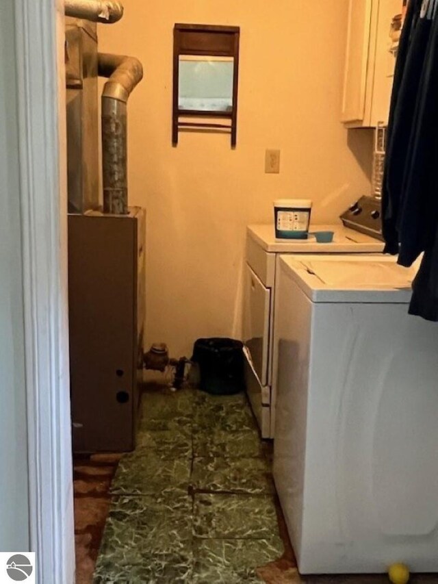 394 Wilson Ave, Mount Morris, MI 48458 - clothes washing area with cabinet space and independent washer and dryer