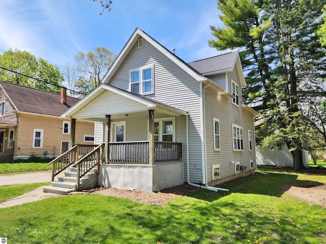 bungalow-style home featuring a porch and a front lawn