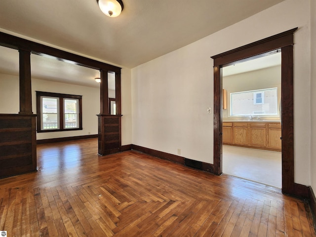 spare room with baseboards